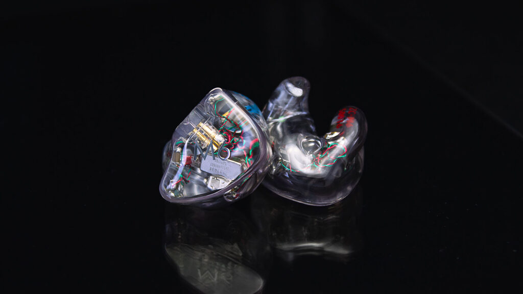 A pair of clear M6 In-Ear Monitors