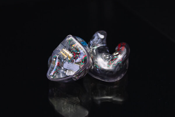 A pair of clear M6 In-Ear Monitors